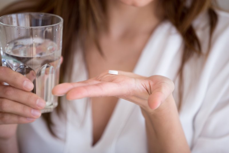 Lady prepares to take over-the-counter pain medication