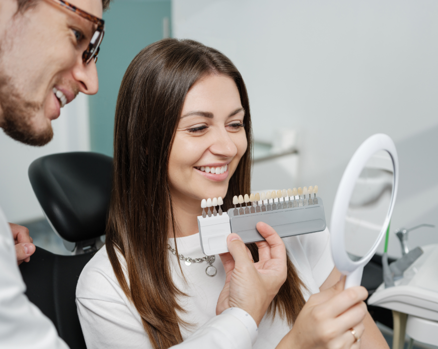 Dentist showing patient veneer shades