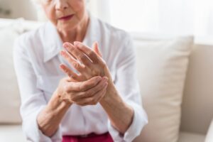 Older woman with arthritis in hands. 
