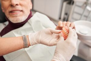Man with dentures at his dental checkup